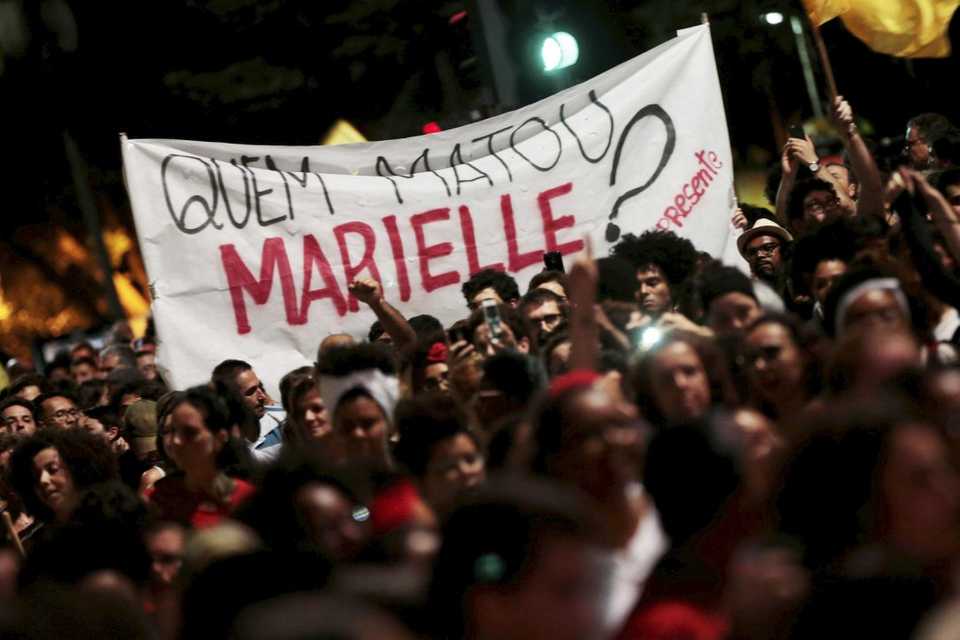 People take part in a rally against the murder of Brazilian councilwoman Marielle Franco, in Sao Paulo